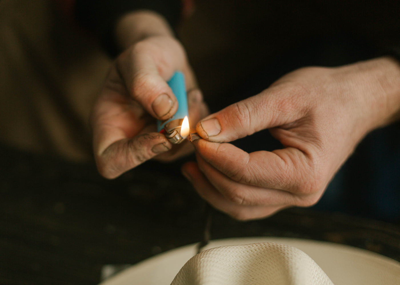 Burning the ends of a bolo tie necktie