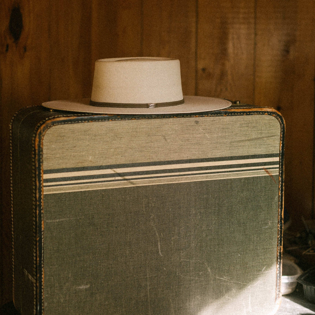 Flatbrim Nevada Hat on Suitcase