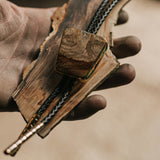 A close-up view of the intricate patterns on the Bolo Tie, also known as a Bolo Necktie or Cowboy Tie, by Hells Canyon Bolo Co.