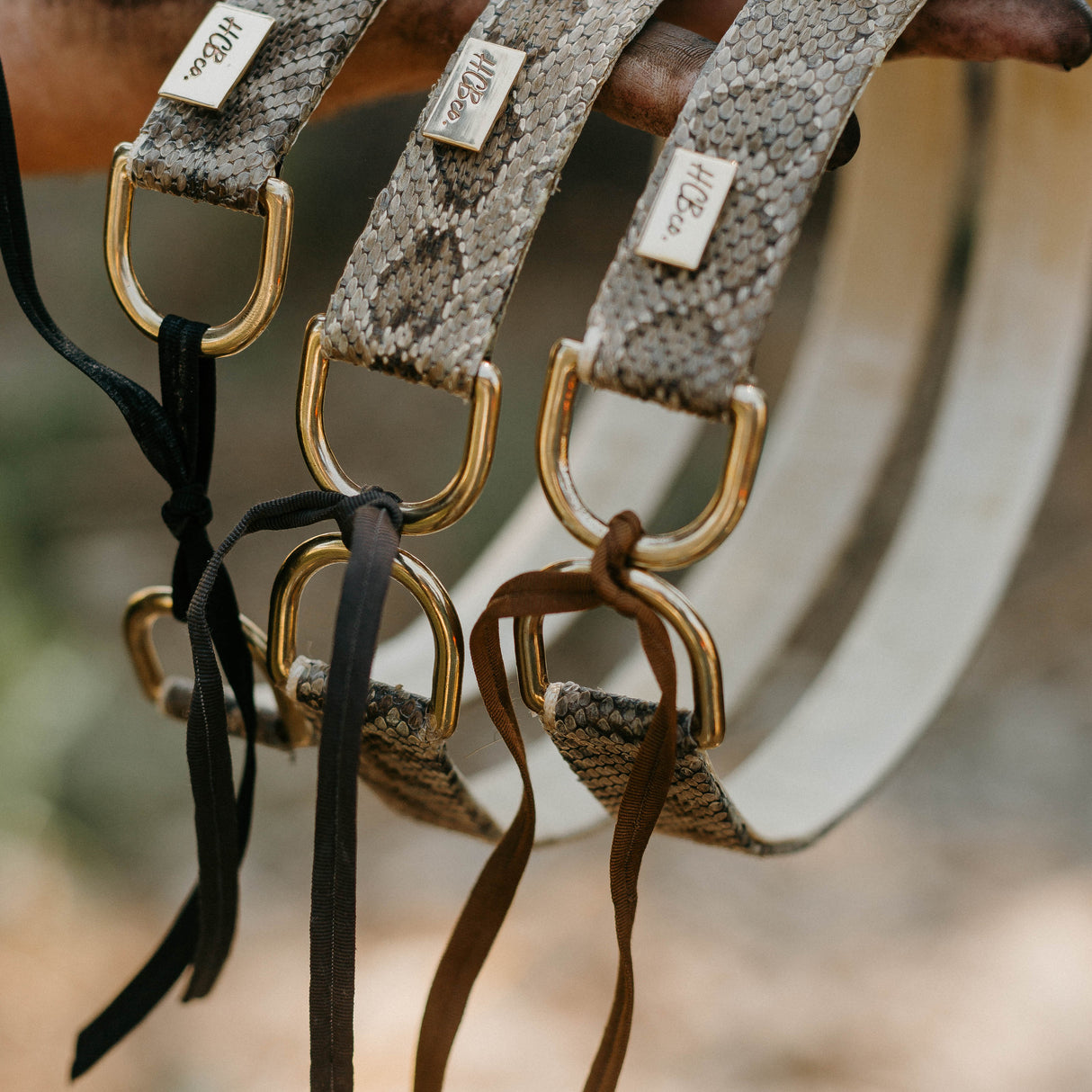 Elevate your hat game with our handcrafted rattlesnake leather hatband featuring a gem stud accent. Meticulously crafted to exude authentic Western spirit, this unique accessory adds rugged charm and timeless appeal to any cowboy hat. Stand out with style and sophistication inspired by the Wild West