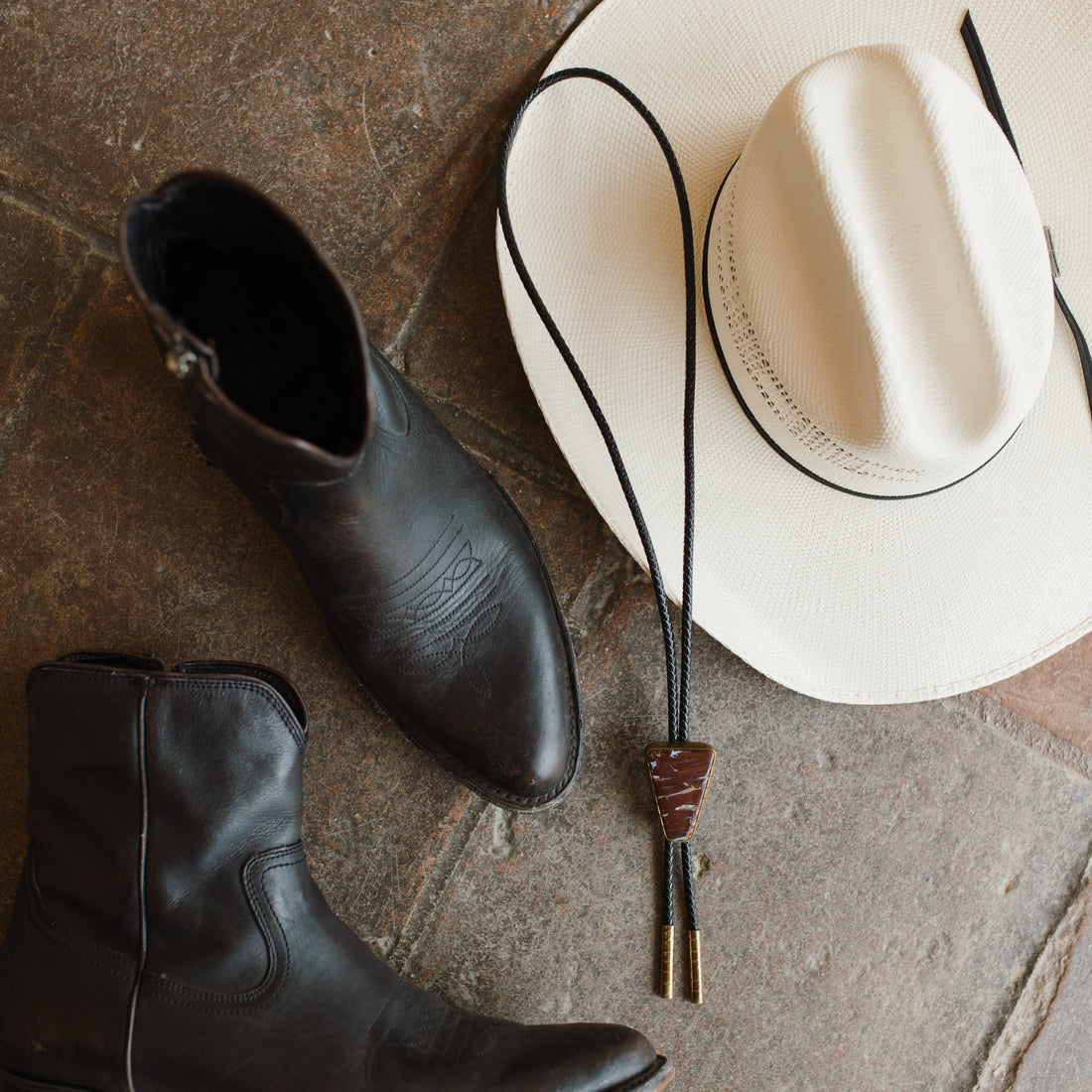 Rattlesnake Jasper Bolo Tie adds Western flair to a groom's outfit while maintaining a modern, classy vibe. 