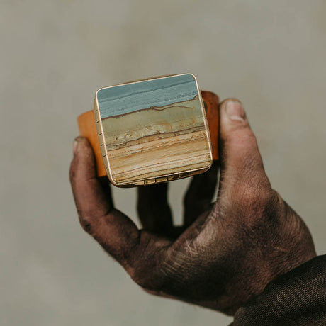 Discover the epitome of Western modern style with our handmade Succor Creek Picture Jasper belt buckle. Crafted with meticulous attention to detail, this unique accessory boasts captivating blue tones reminiscent of the serene Western skies. Elevate your look with a touch of rustic elegance that's entirely handmade, perfect for adding a bold statement to any ensemble.