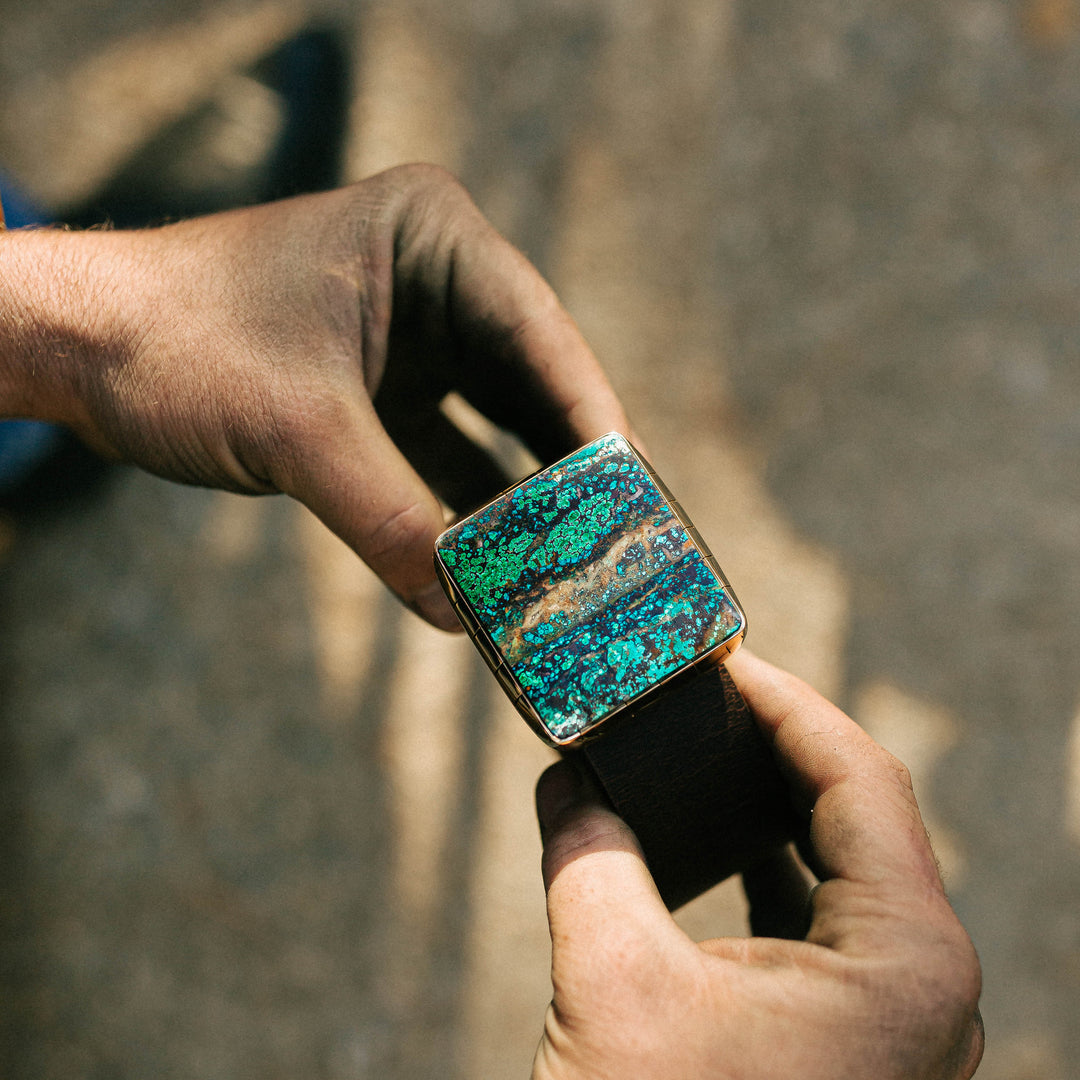 Square Spiderweb Chrysocolla belt buckle with blue-green stone and dark web matrix, handcrafted by Hells Canyon Bolo Co.